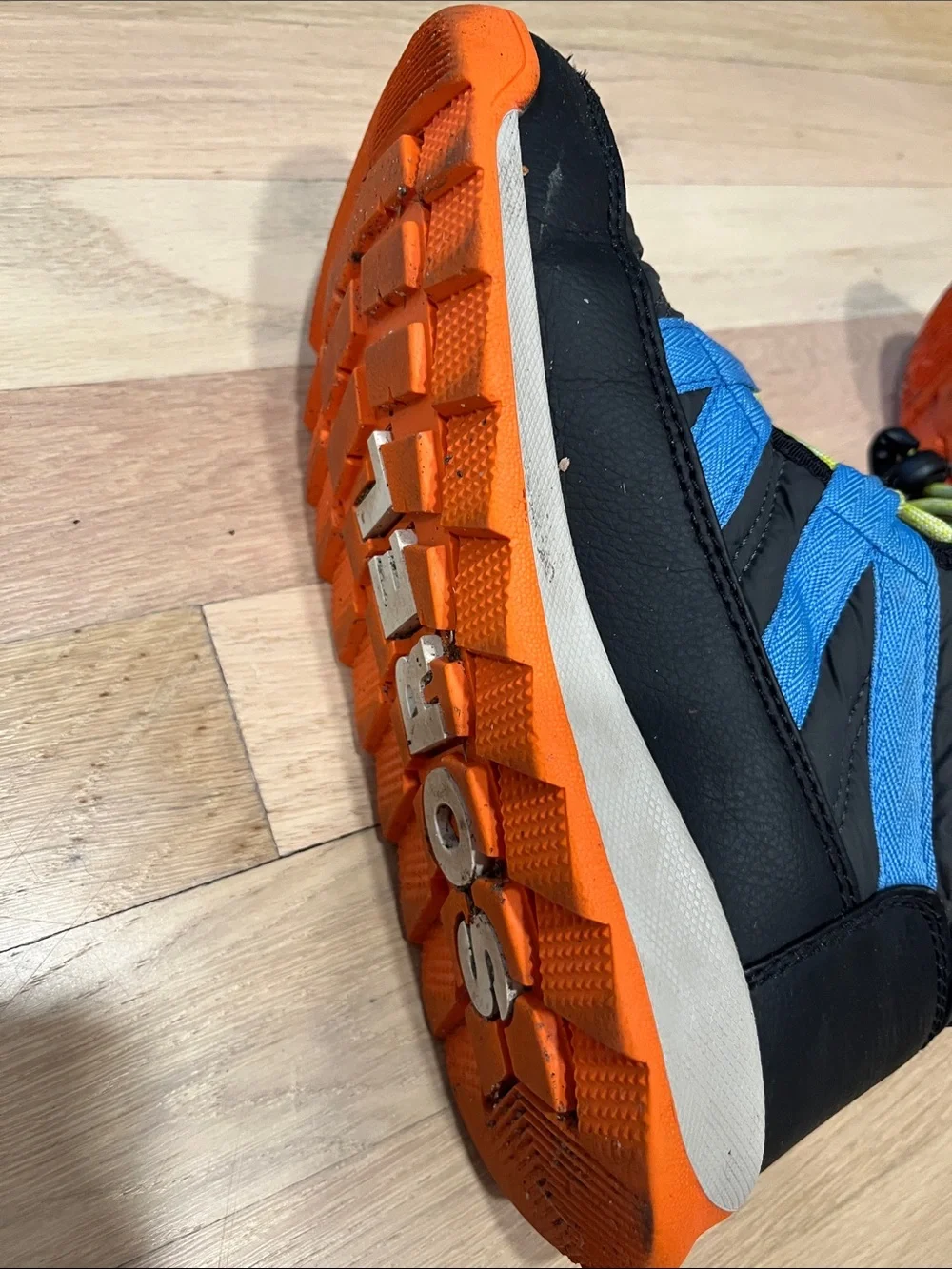 Sorel Kids Black Boots with Blue Stripes and Orange Sole